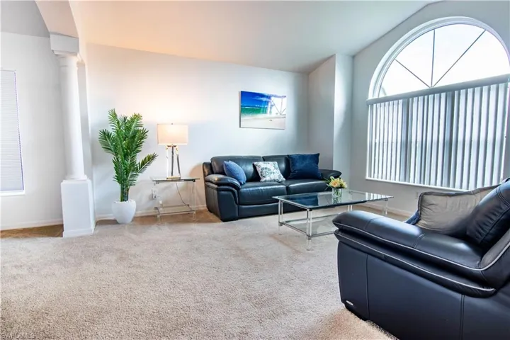 Living room with decorative columns and carpet