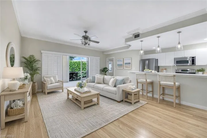 Virtually Staged - Family room and expansive breakfast bar