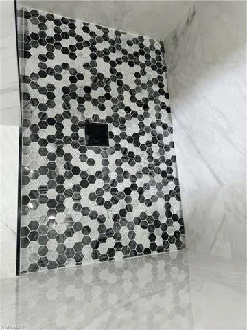Interior details featuring a tile shower