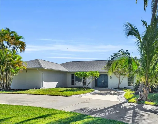Ranch-style home with a front lawn