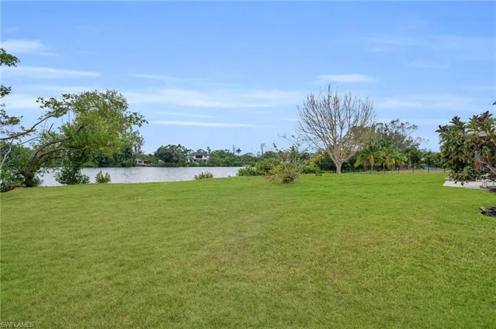 View of yard with a water view