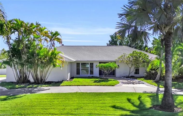 Ranch-style house with a front lawn