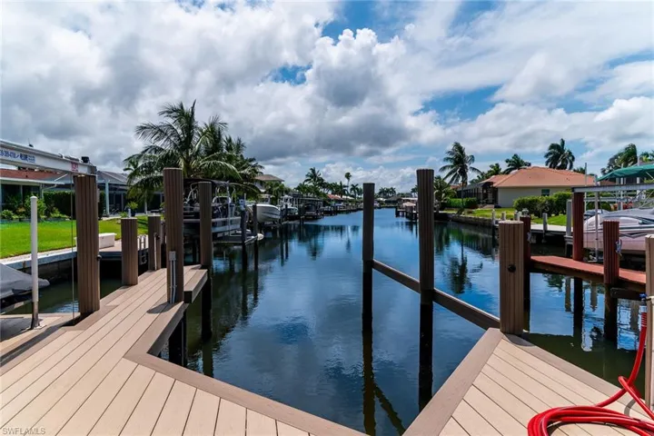 Composite wood-finish dock providing direct canal access