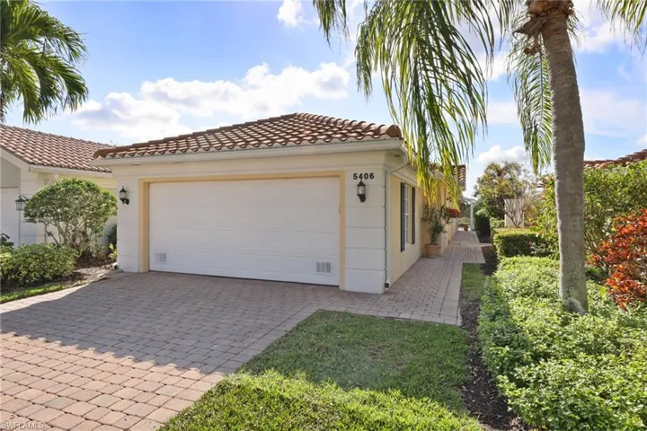 View of side of home featuring a garage