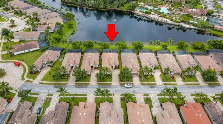 Drone / aerial view with a residential view and a water view