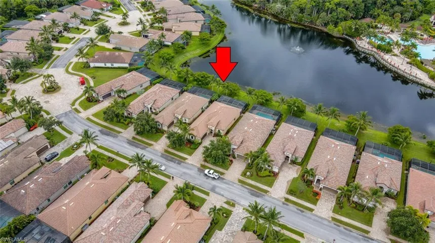 Aerial view featuring a water view and a residential view