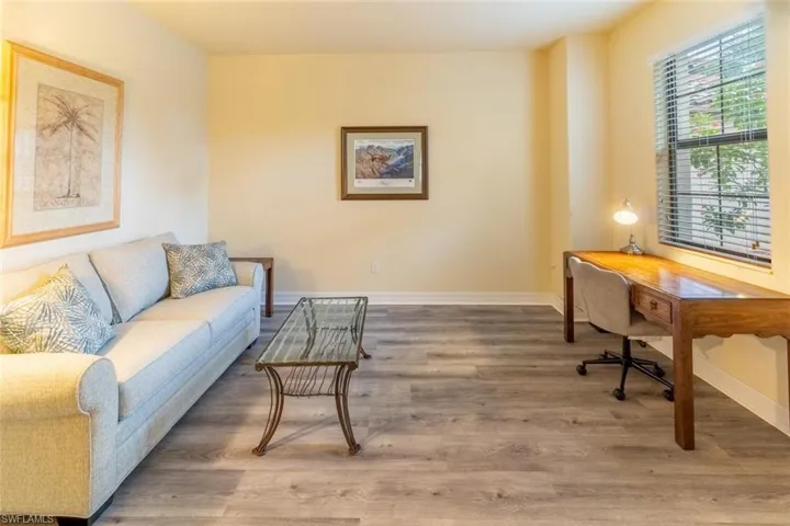 Home office featuring baseboards and wood finished floors