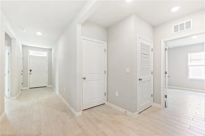 Hall featuring recessed lighting and light wood-type flooring