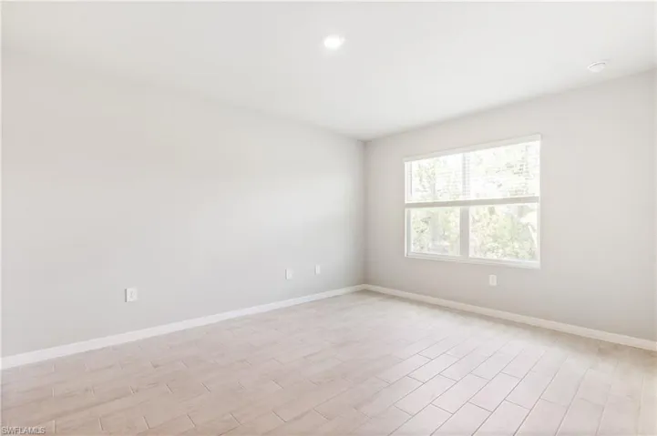 Unfurnished room featuring light wood-type flooring and recessed lighting