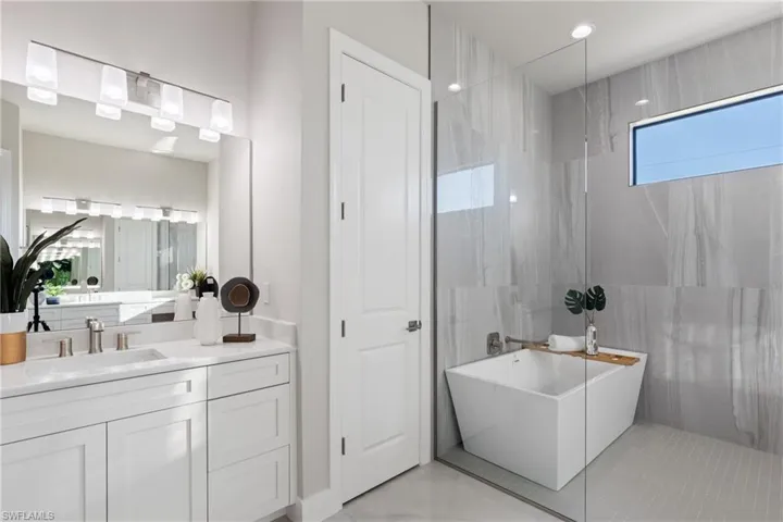 Bathroom with vanity and a bathtub