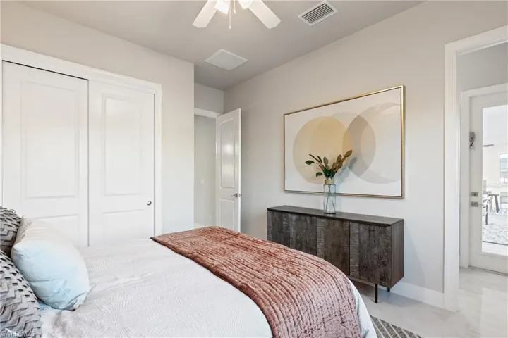 Bedroom featuring a closet and ceiling fan