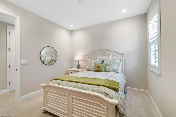 Bedroom featuring light colored carpet and recessed lighting