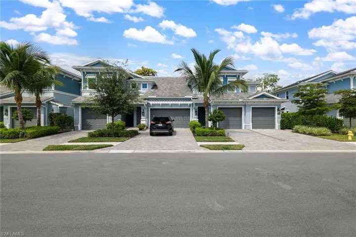 View of front of house with driveway and a garage