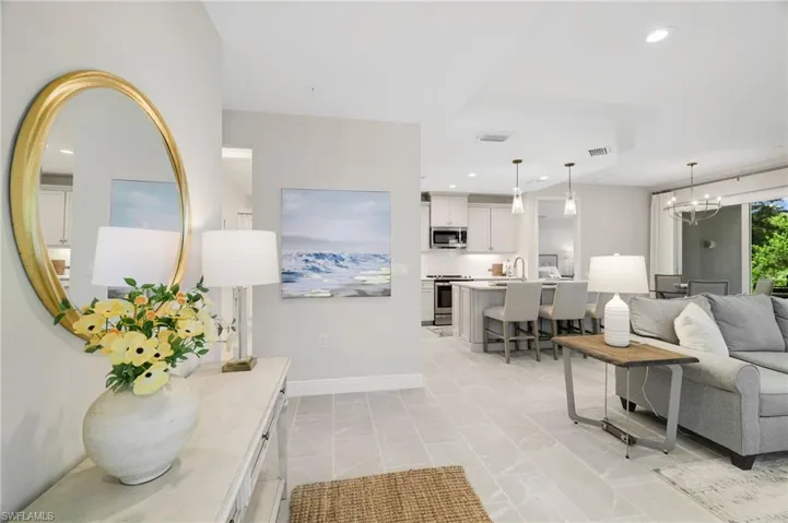 Living area featuring a chandelier and recessed lighting