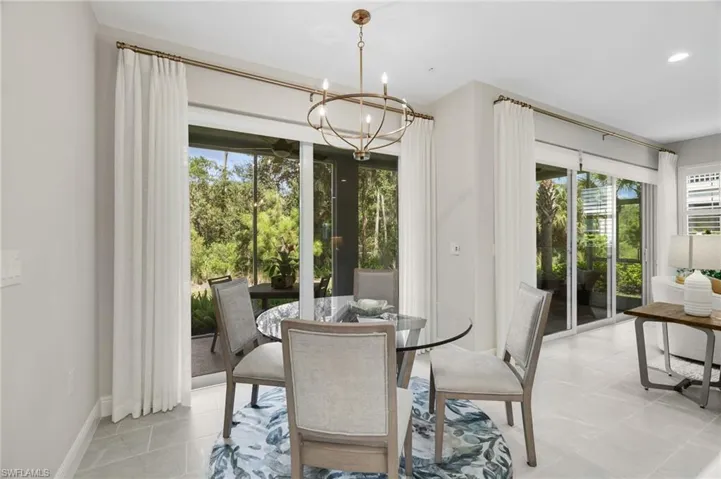 Dining area featuring a chandelier and recessed lighting