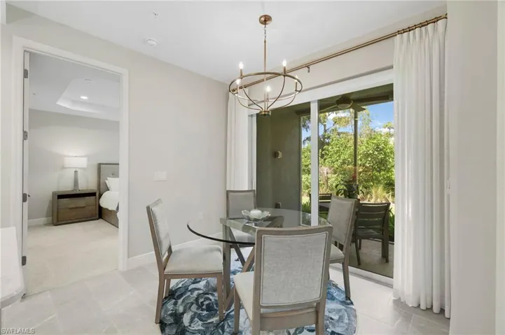Dining area featuring a chandelier and recessed lighting