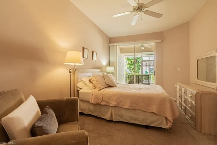 Carpeted bedroom with ceiling fan