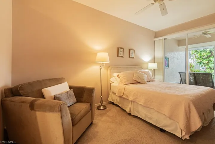 Bedroom featuring access to outside, ceiling fan, and light colored carpet