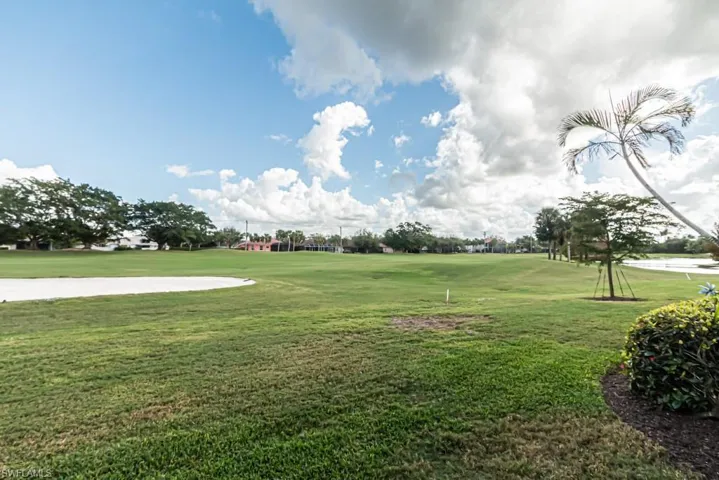 View of property's community featuring a lawn