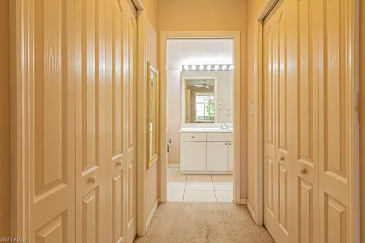 Hall with light colored carpet