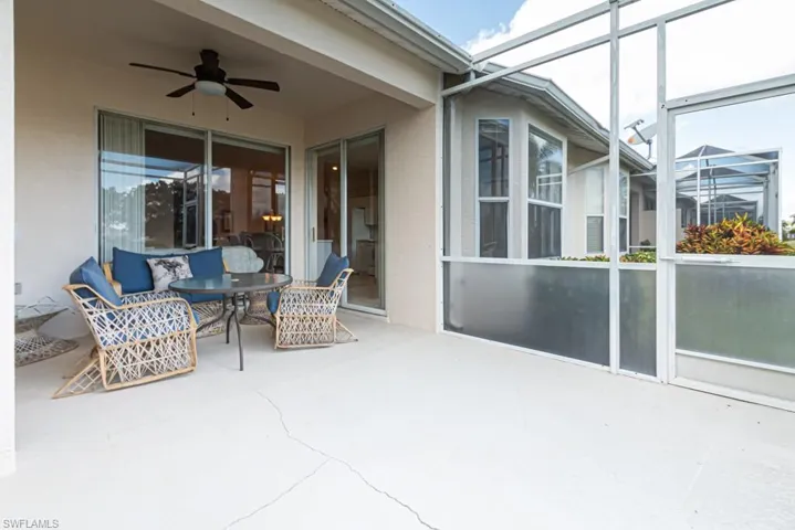 Sunroom / solarium featuring ceiling fan