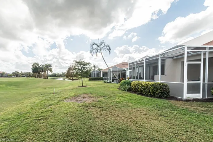 View of yard with a lanai