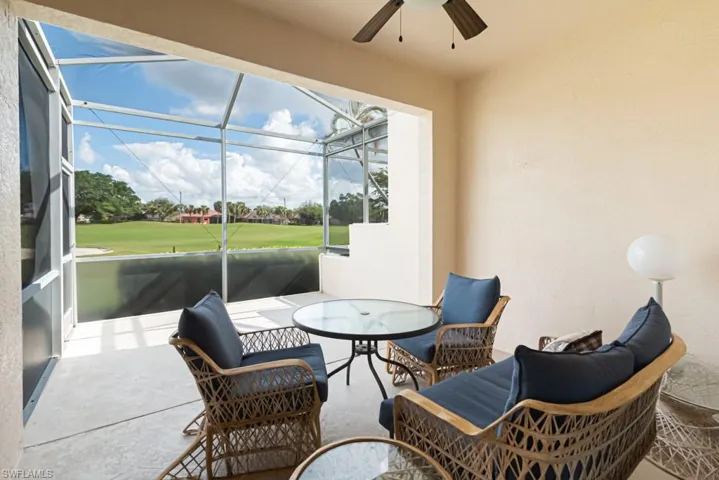 Sunroom featuring ceiling fan