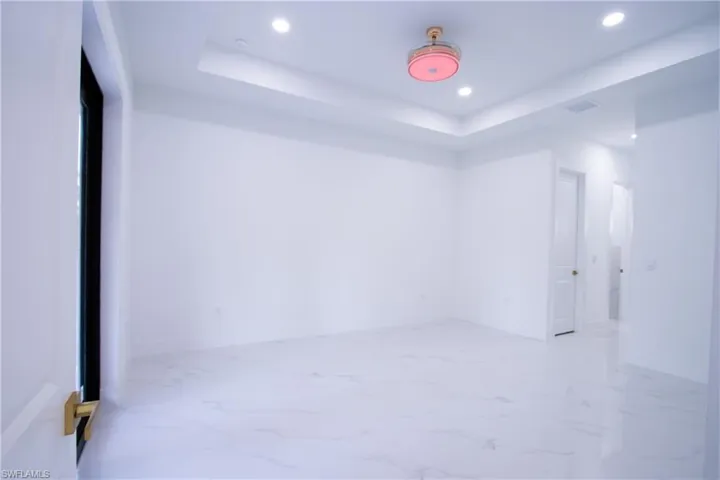 Empty room with a raised ceiling