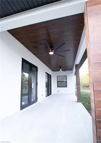 View of patio / terrace with french doors and ceiling fan
