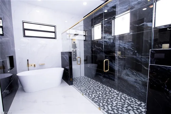 Bathroom with shower with separate bathtub