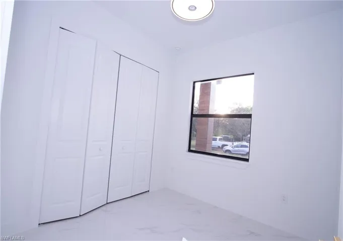 Unfurnished bedroom with a closet