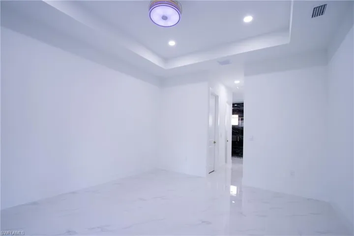 Spare room with a raised ceiling