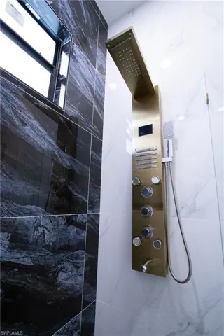 Interior details with a tile shower
