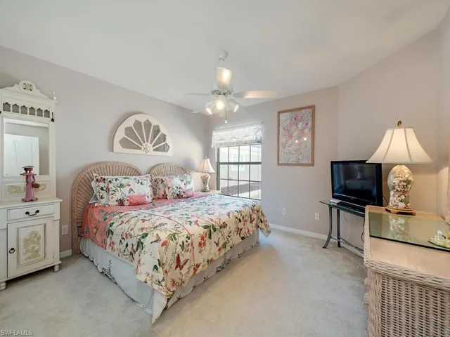 Bedroom featuring carpet and a ceiling fan