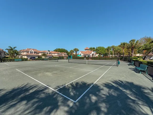 View of tennis court featuring community basketball court
