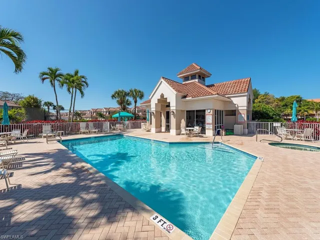 Community pool featuring a patio area and a community hot tub