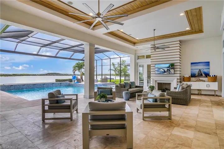 View of patio featuring an outdoor hangout area, a lanai, and ceiling fan