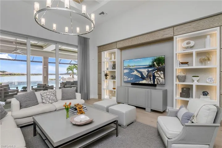 The open great room is warm and inviting with fabulous sunset views of Wildblue Lake.