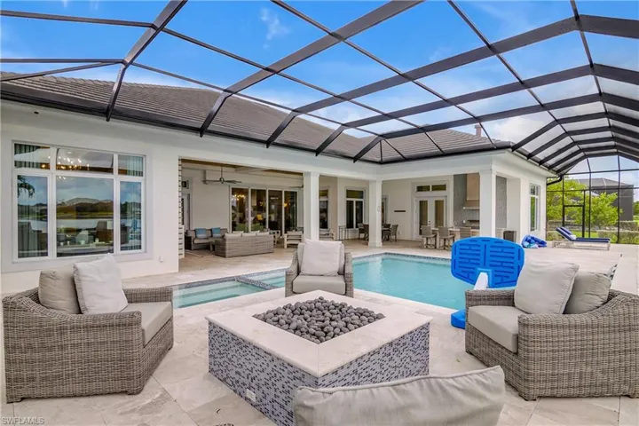 View of pool featuring ceiling fan, an outdoor hangout area, a lanai, and a patio area