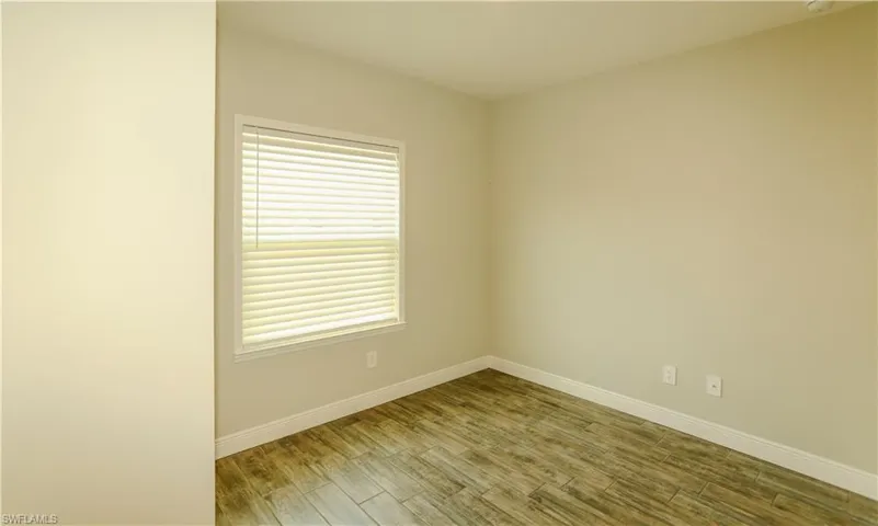 Empty room featuring light wood-style floors and baseboards