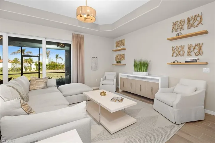 Living room with wood finished floors and baseboards