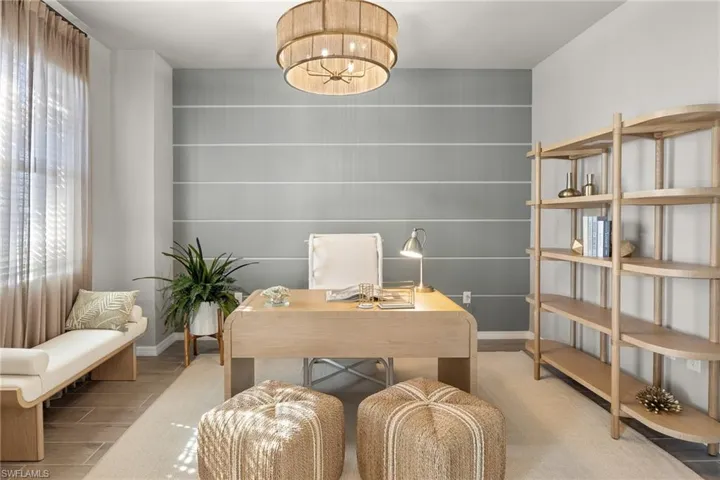 Office space with wood finished floors and baseboards