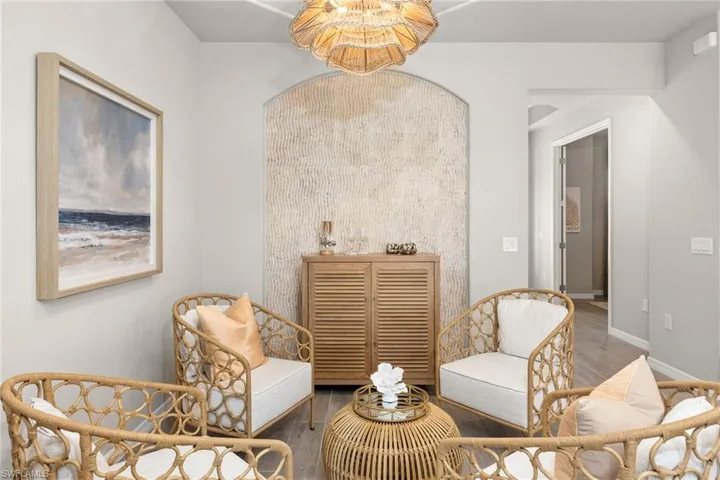 Sitting room featuring wood finished floors and baseboards