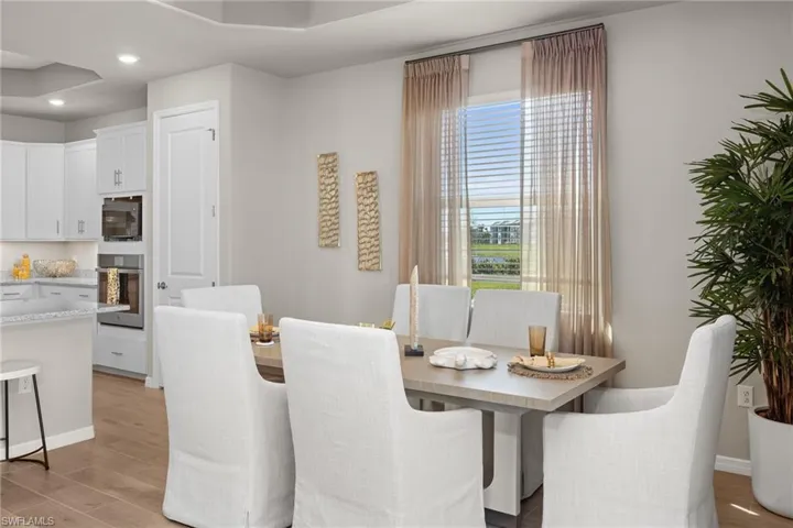 Dining room featuring light wood-style floors and recessed lighting