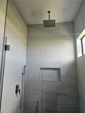 Details featuring a shower with shower door
