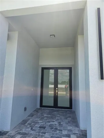 Property entrance with french doors