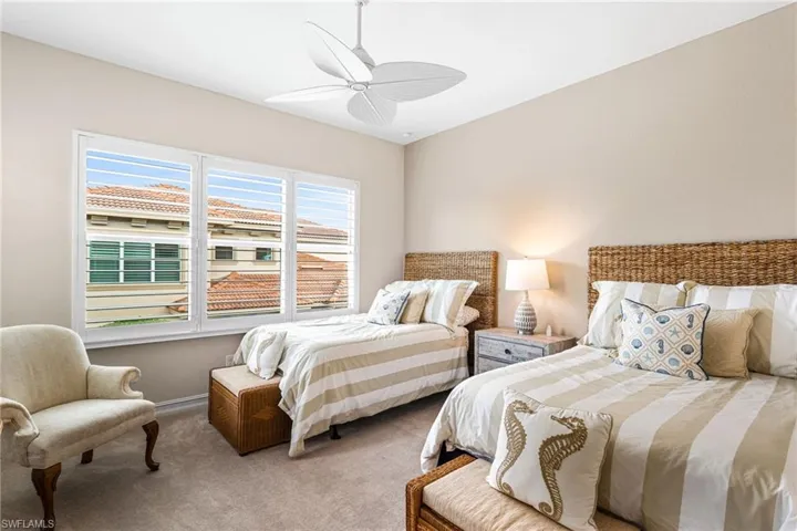 Bedroom with carpet and ceiling fan