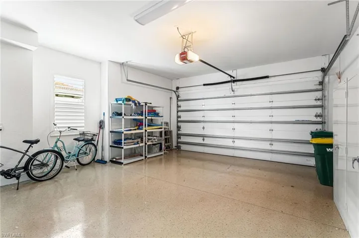 Garage featuring a garage door opener