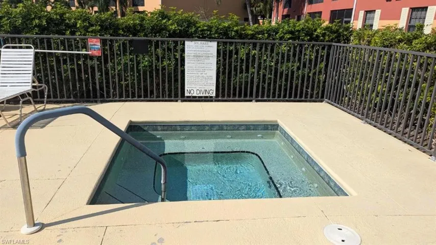 View of pool featuring a community hot tub