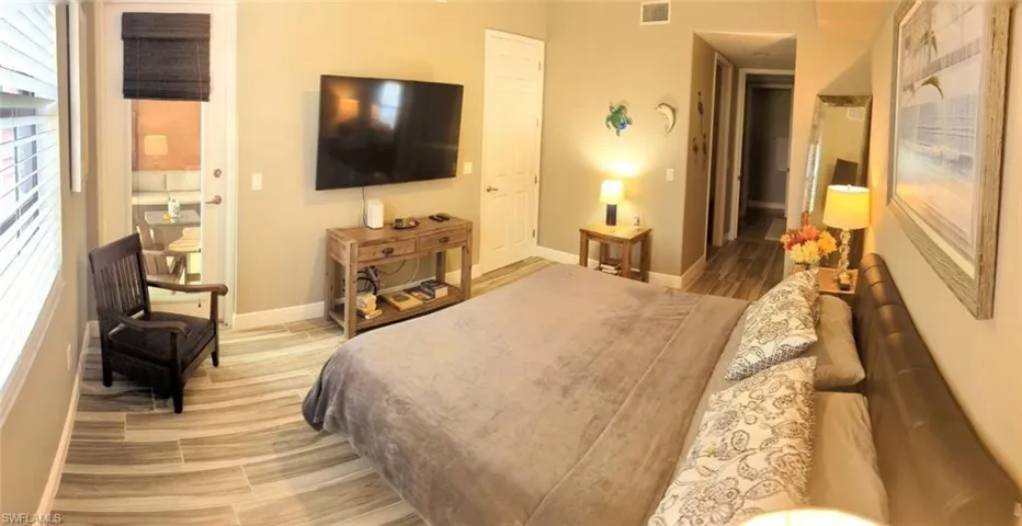 Bedroom with light hardwood / wood-style floors